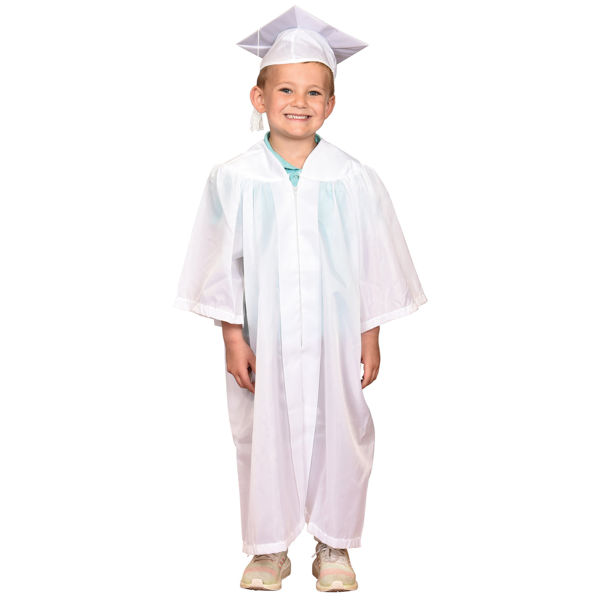 A young boy in a white graduation cap and gown